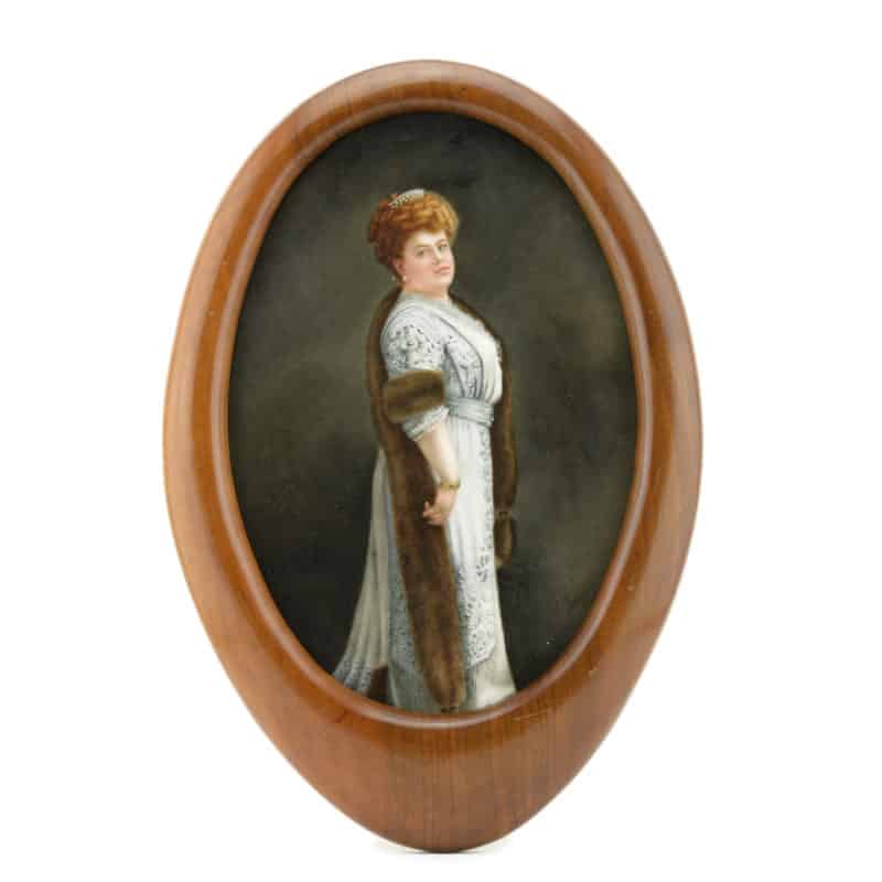 A Russian framed & signed painted porcelain plaque with portrait of a society lady