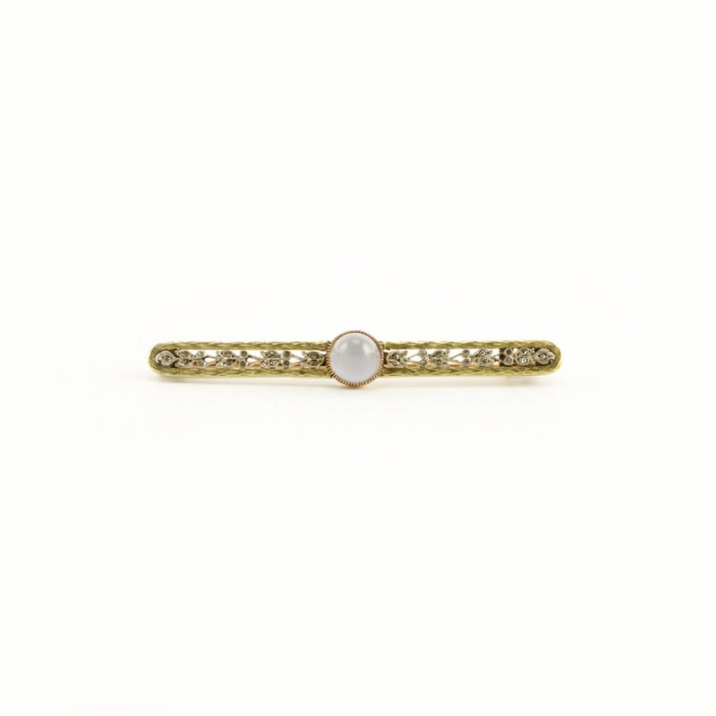 A Fabergé two-color gold, moonstone, & diamond brooch