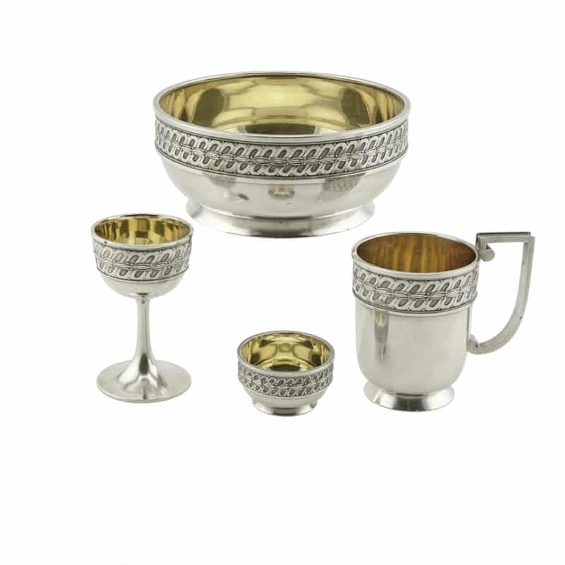 A Fabergé four-piece silver dining set for one
