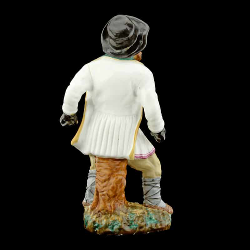 An antique Russian porcelain figure of a peasant boxer - Image 2