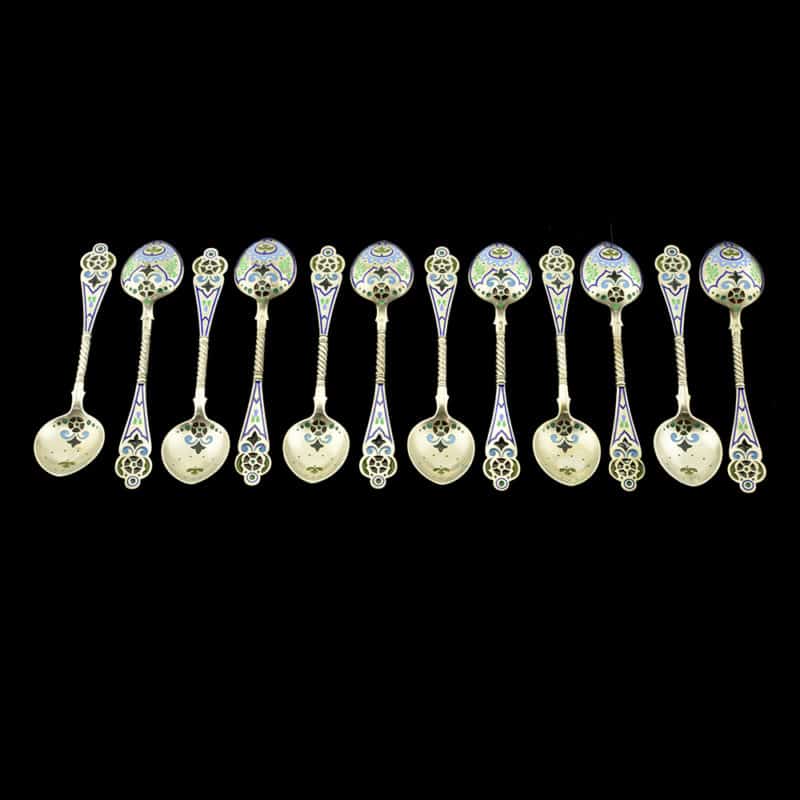 A set of 12 Russian silver gilt and champleve, plique-a-jour enamel sherbet spoons