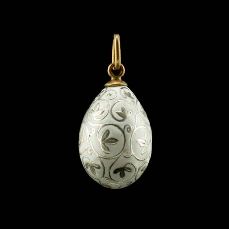 A Russian gold-mounted silver & opaque enamel miniature pendant egg