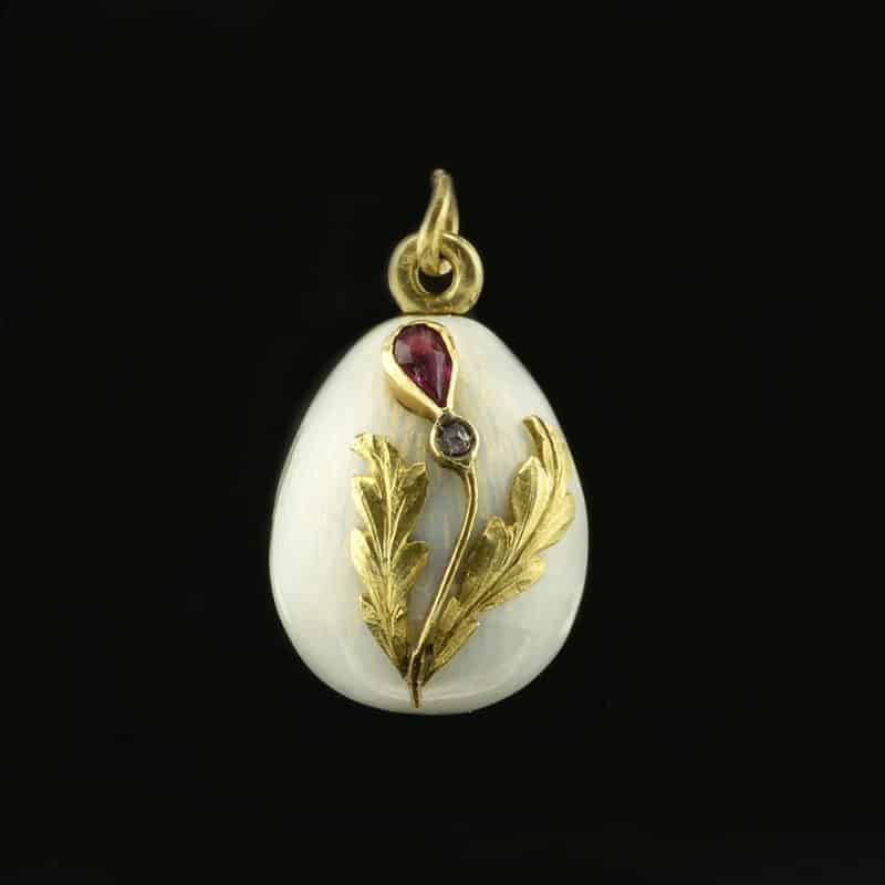 A Russian jeweled gold and guilloché enamel miniature pendant Easter egg
