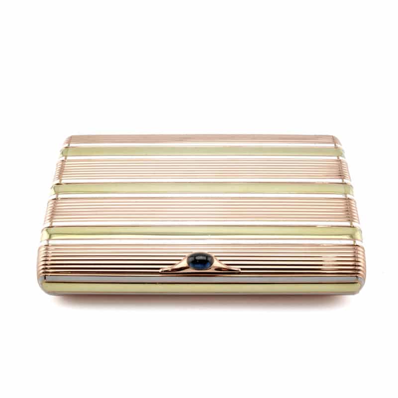 A Fabergé two-color gold & enamel cigarette case with cabochon sapphire thumbpiece