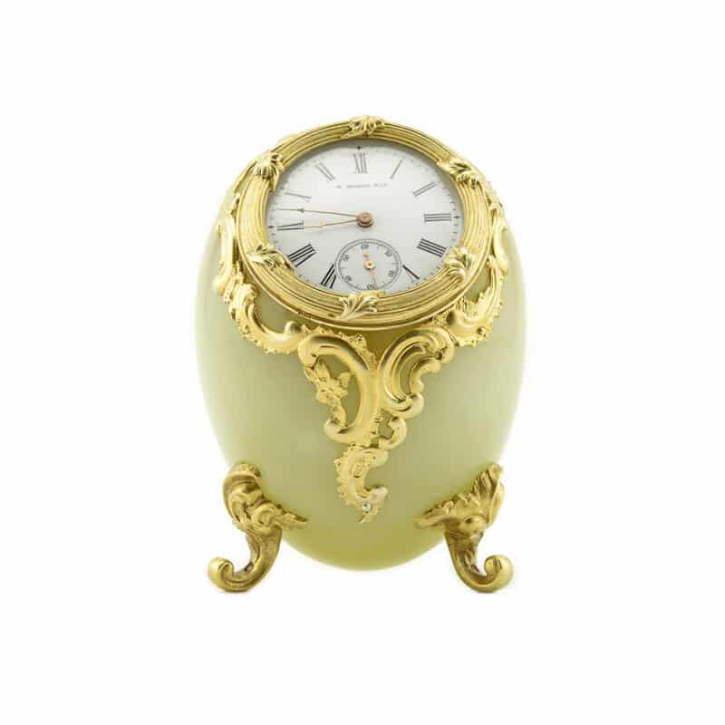 A Faberge Bowenite and Silver Figural Egg-Shaped Desk Clock, Michael Perchin