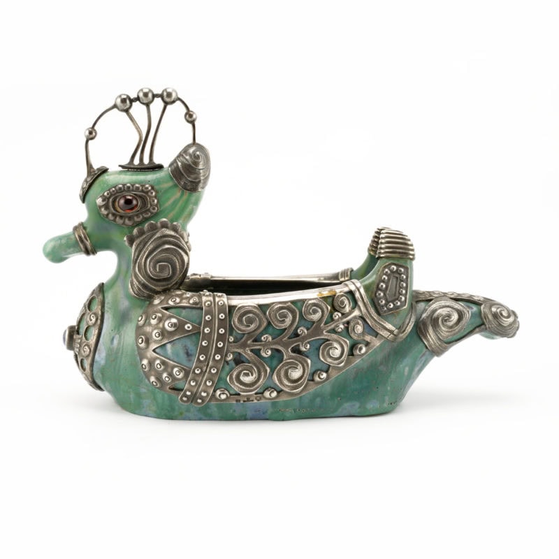 An extremely rare Fabergé gem-set silver-mounted ceramic duck form kovsh from the Imperial Stroganov School