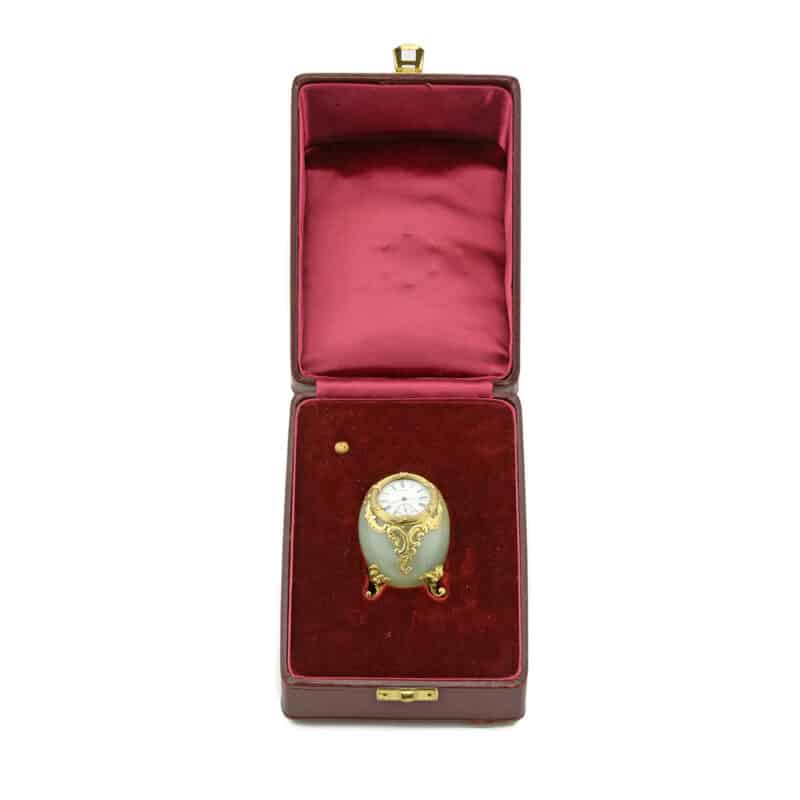 A Faberge Bowenite and Silver Figural Egg-Shaped Desk Clock, Michael Perchin - Image 2